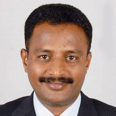 <a href="https://universalinstitutions.com/about-us/#">J Santhosh Shetty</a>